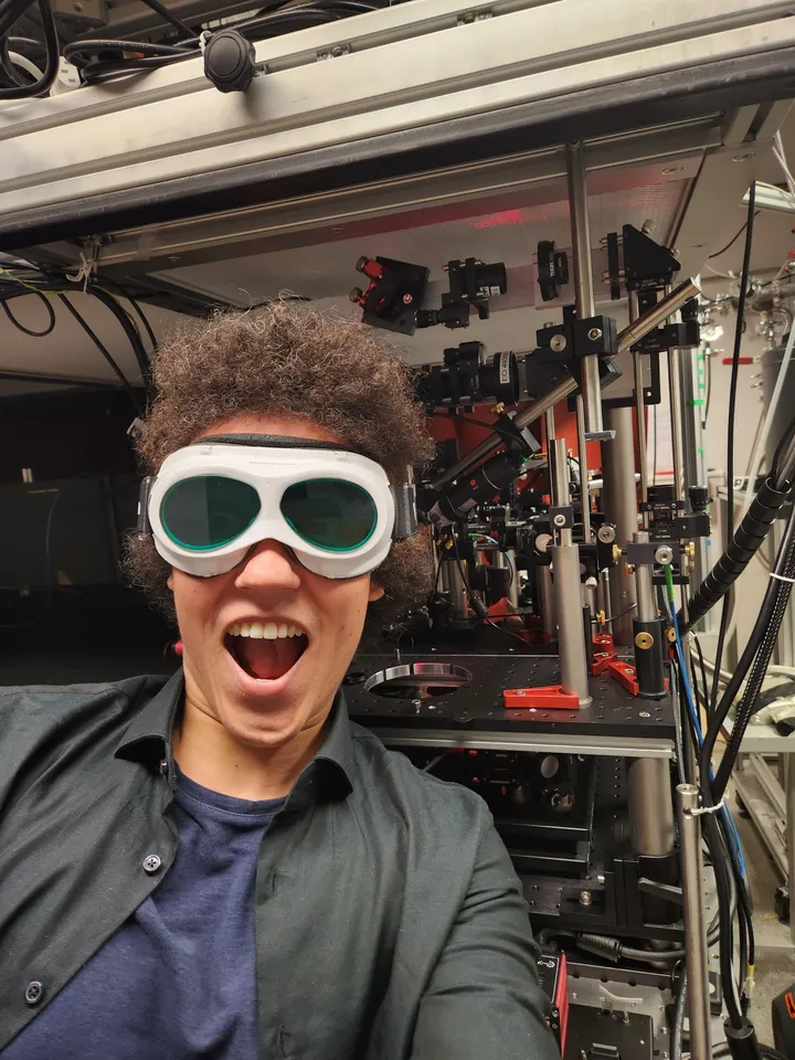 Benjamin in the physics lab, laser goggles on